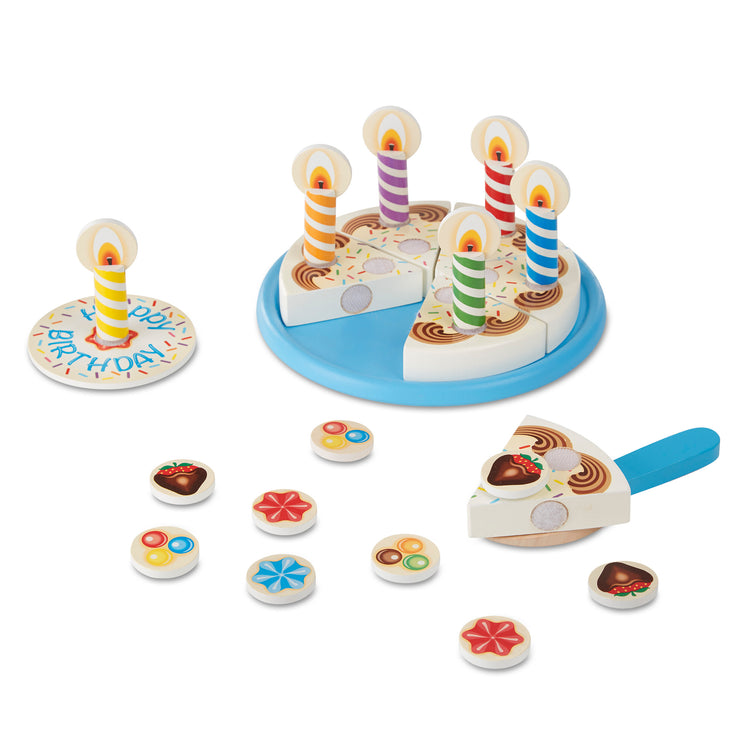 The loose pieces of The Melissa & Doug Birthday Party Cake - Wooden Play Food With Mix-n-Match Toppings and 7 Candles