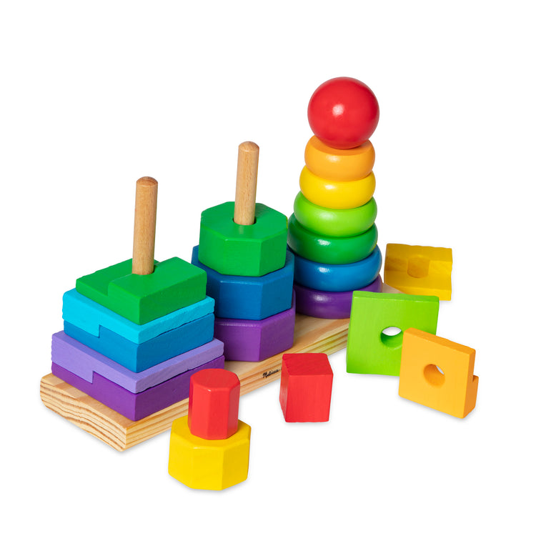 The loose pieces of The Melissa & Doug Geometric Stacker - Wooden Educational Toy