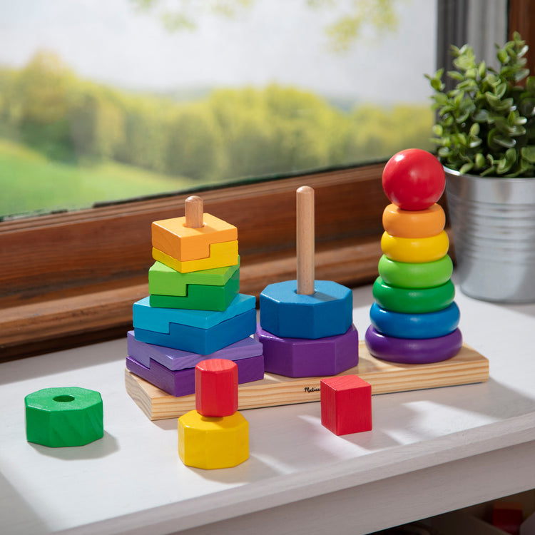 A playroom scene with The Melissa & Doug Geometric Stacker - Wooden Educational Toy