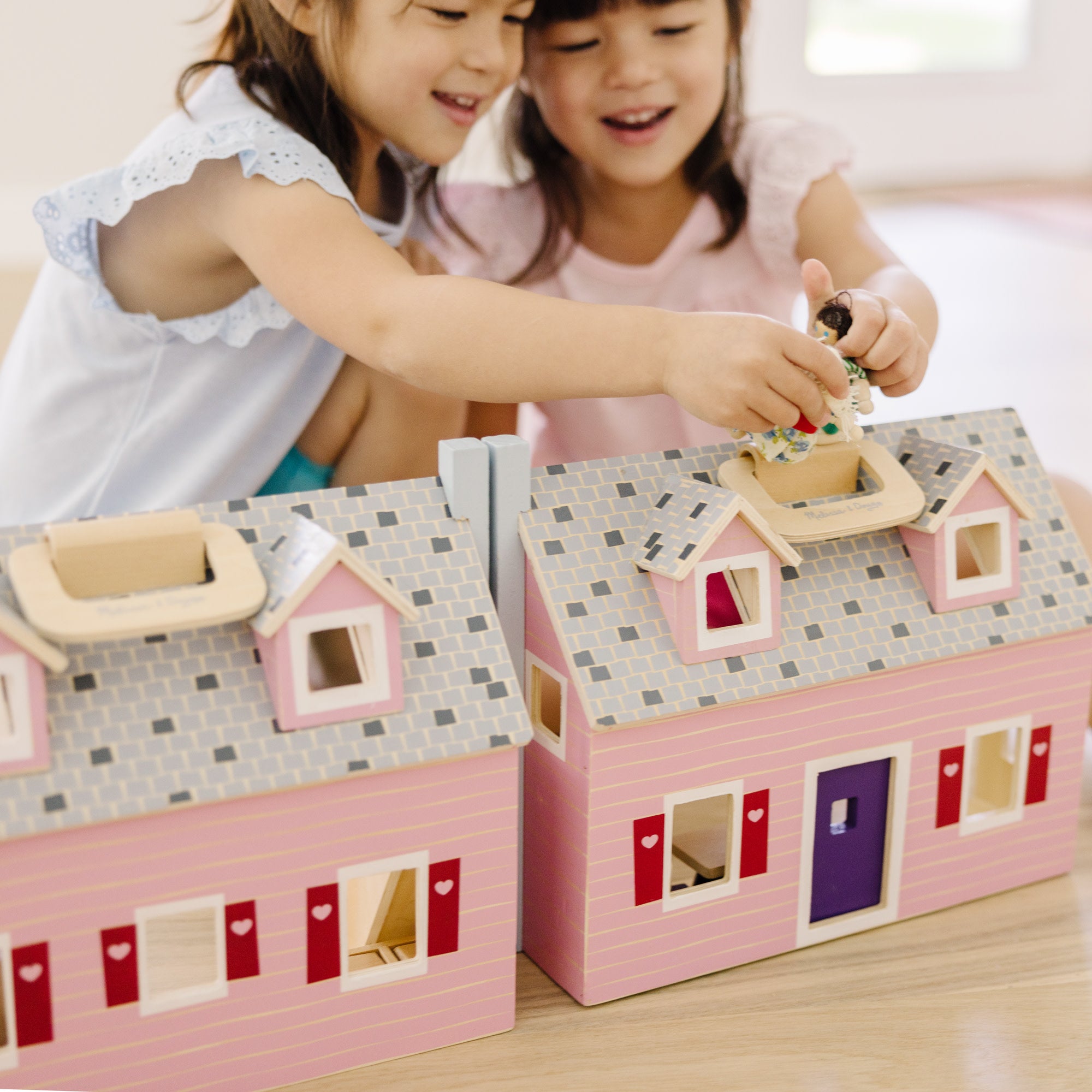 Melissa and doug pink sales dollhouse