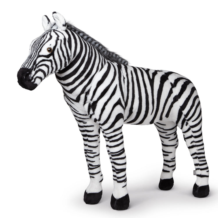 The loose pieces of The Melissa & Doug Giant Striped Zebra - Lifelike Stuffed Animal (nearly 3 feet tall)