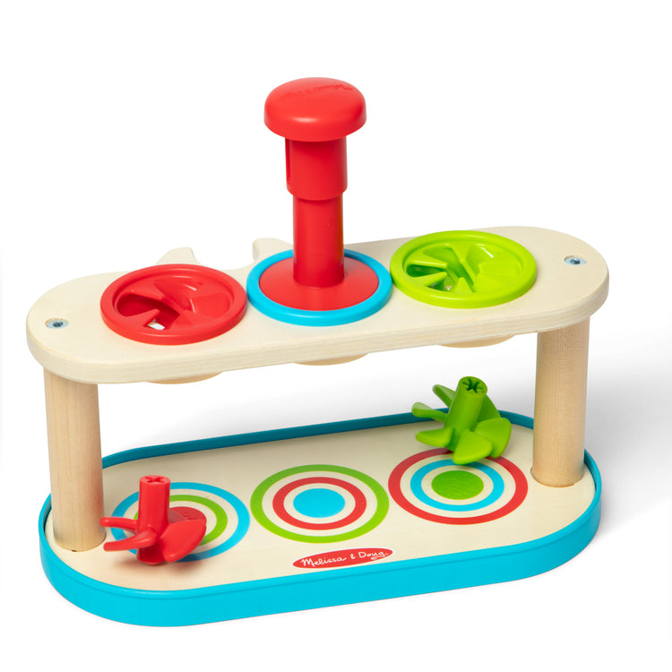 The loose pieces of The Melissa & Doug Match & Push Spinning Tops Developmental Skills Toy for Girls and Boys 2+ 