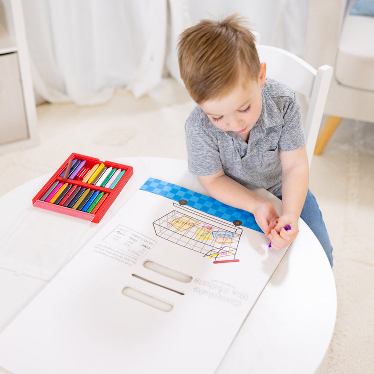 A kid playing with The Melissa & Doug Children's Book - Poke-a-Dot: Who’s in the Ocean (Board Book with Buttons to Pop)