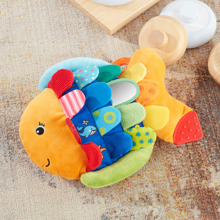 A playroom scene with The Melissa & Doug Flip Fish Soft Baby Toy