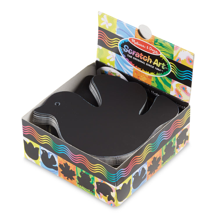 The loose pieces of The Melissa & Doug Scratch Art® Box of 125 Nature-Themed Shaped Notes in Desktop Dispenser (Approx. 3.5” x 3.5” Each Note)