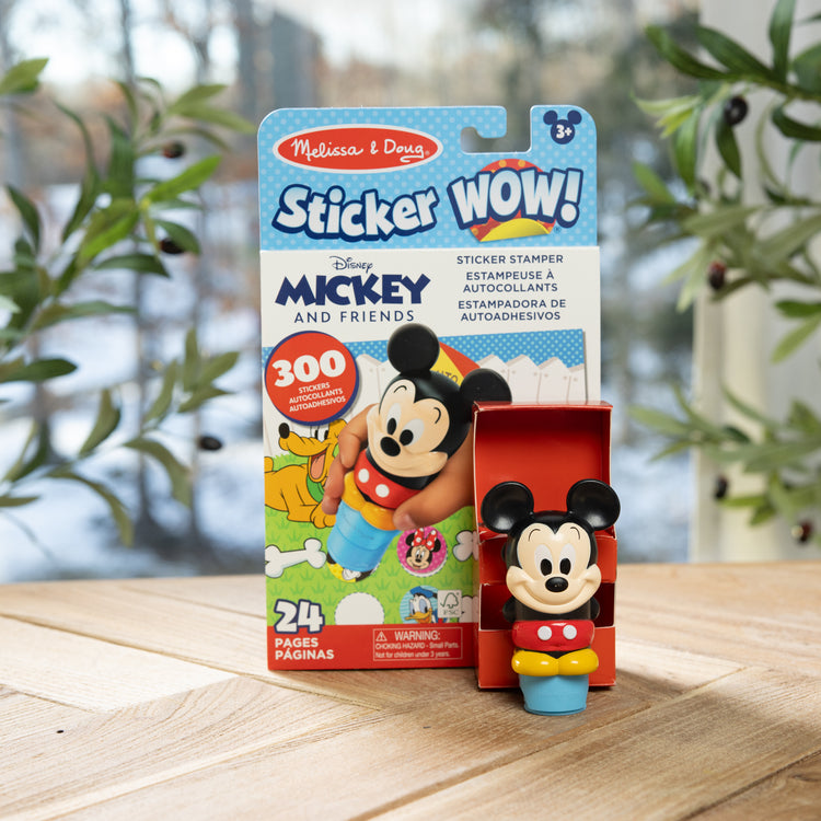 A playroom scene with The Melissa & Doug Sticker WOW!™ 24-Page Activity Pad and Sticker Stamper, 300 Stickers, Arts and Crafts Fidget Toy Collectible Character – Disney Mickey Mouse

