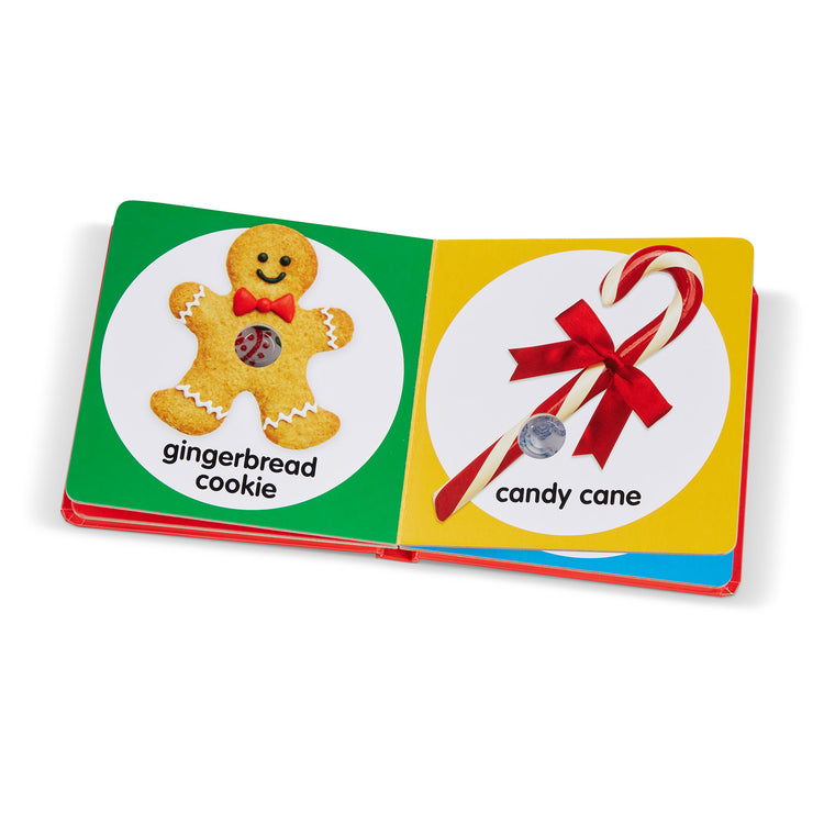 The loose pieces of The Melissa & Doug Children’s Book – Poke-a-Dot: Christmas (Board Book with Buttons to Pop)