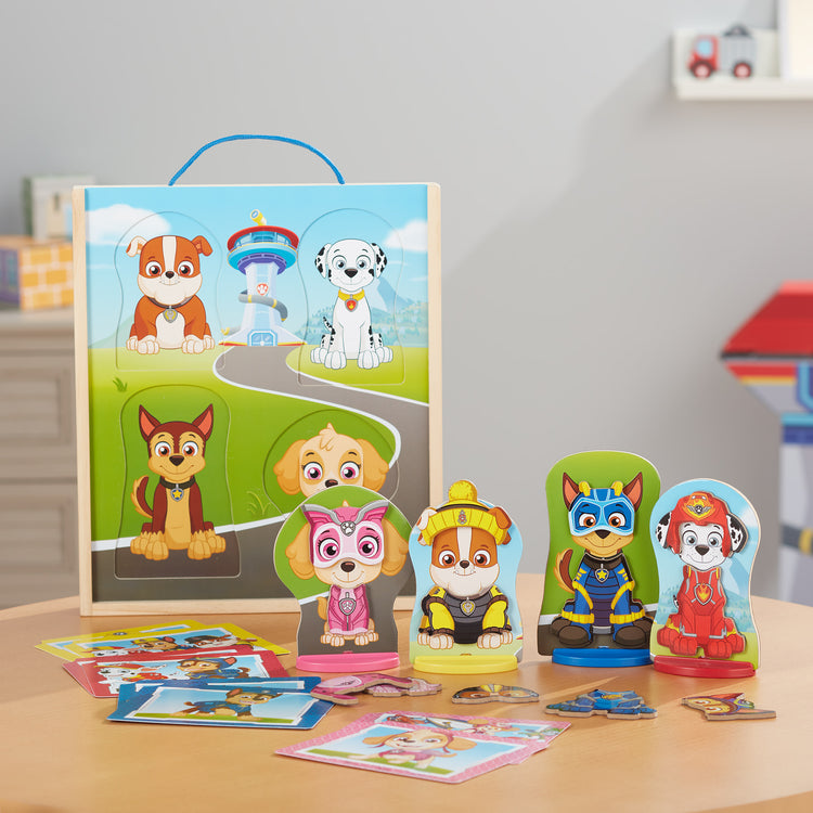 A playroom scene with The Melissa & Doug PAW Patrol Wooden Magnetic Pretend Play (64 Pieces), Multi color