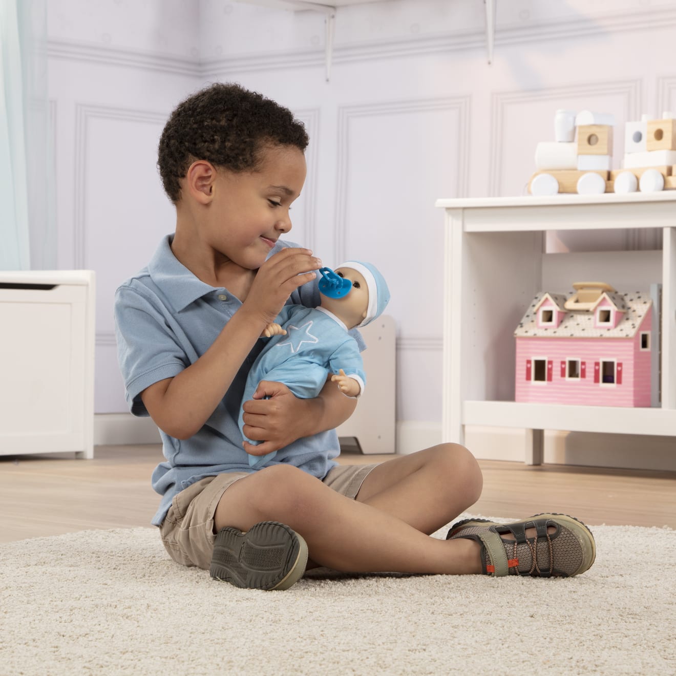 Boy with doll on sale