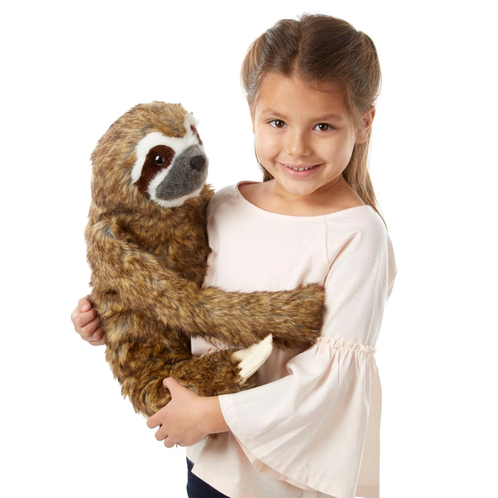 sloth with stuffed animal